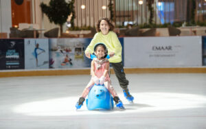 Two children ice skating at Dubai Ice Rink