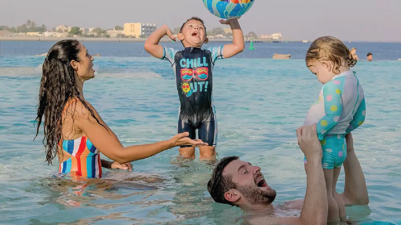 Family enjoying their private beach access at Vida Hotels and Resorts